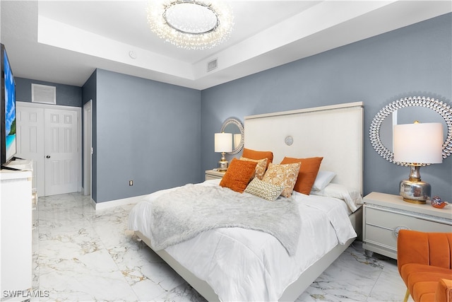 bedroom with a tray ceiling