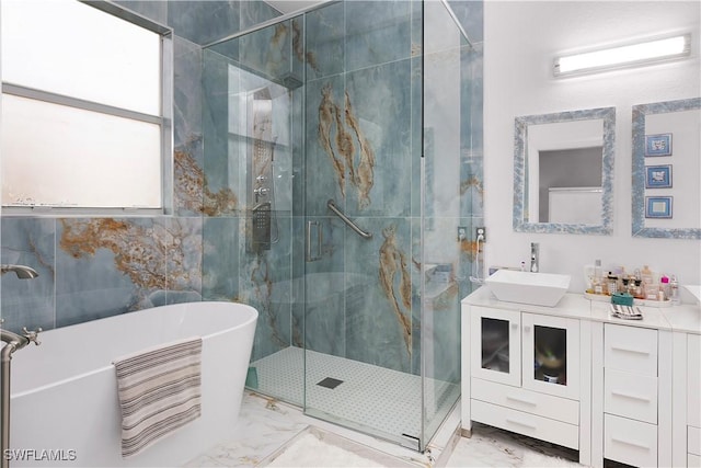 9801 Boraso Way Unit 103, Fort Myers, FL 33908 - full bath with marble finish floors, a soaking tub, vanity, a stall shower, and tile walls