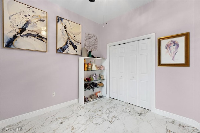 9801 Boraso Way Unit 103, Fort Myers, FL 33908 - unfurnished bedroom featuring marble finish floors and a closet