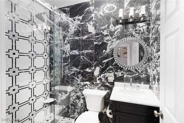 9801 Boraso Way Unit 103, Fort Myers, FL 33908 - full bathroom featuring vanity, tile walls, and a marble finish shower