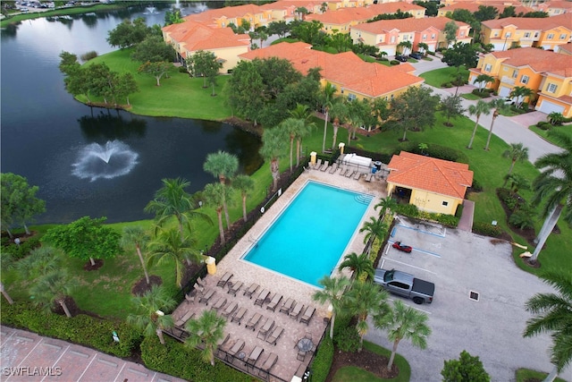 birds eye view of property with a water view