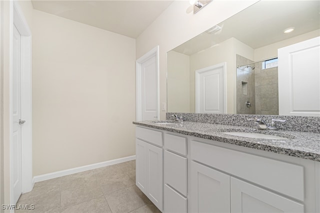 bathroom with vanity, tile patterned floors, and an enclosed shower