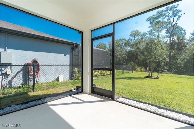 unfurnished sunroom with plenty of natural light