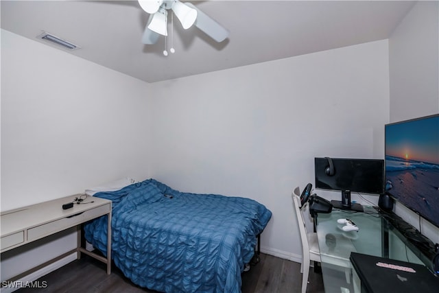 bedroom featuring ceiling fan and dark hardwood / wood-style flooring