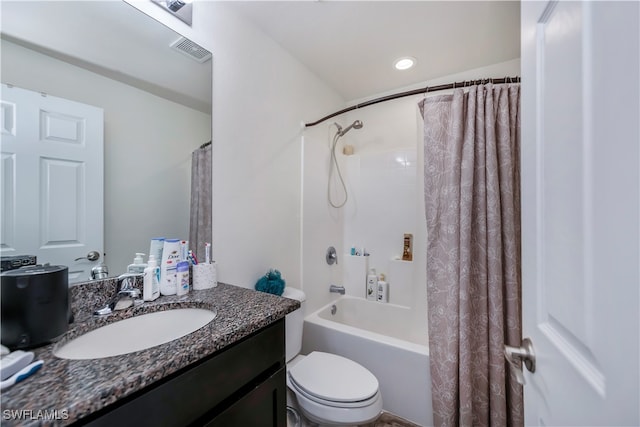 full bathroom with toilet, vanity, and shower / bath combination with curtain