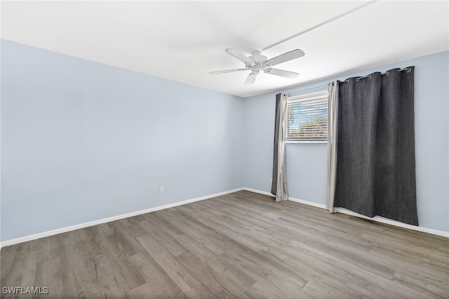 empty room featuring light hardwood / wood-style flooring and ceiling fan