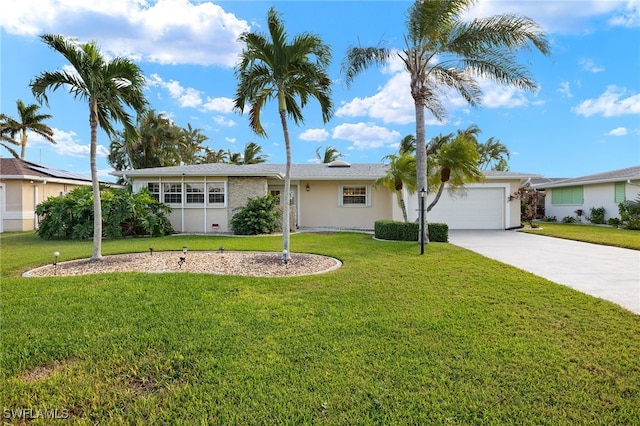 single story home featuring a garage and a front lawn