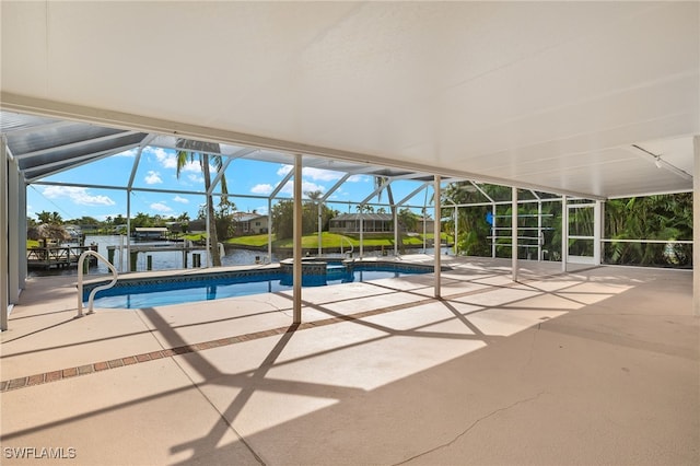 view of pool featuring a patio, a water view, and a lanai