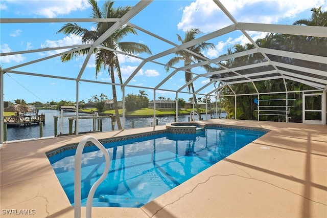 view of pool featuring glass enclosure, a water view, a dock, and a patio