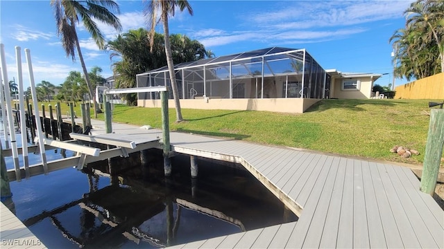 view of dock featuring a yard and glass enclosure