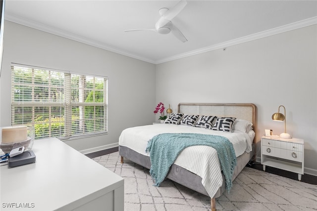 bedroom with ceiling fan, light hardwood / wood-style flooring, and crown molding