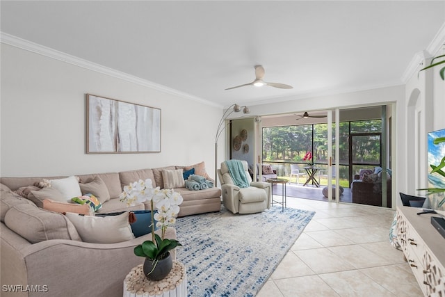 living room featuring light tile patterned flooring, ceiling fan, and ornamental molding