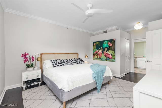 bedroom with ornamental molding, hardwood / wood-style flooring, and ceiling fan