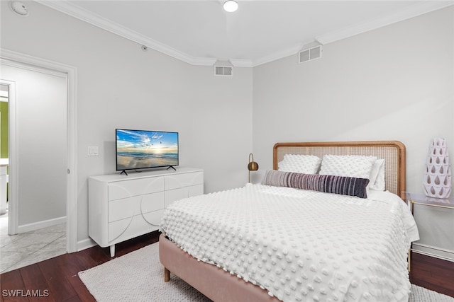 bedroom featuring dark hardwood / wood-style floors and ornamental molding