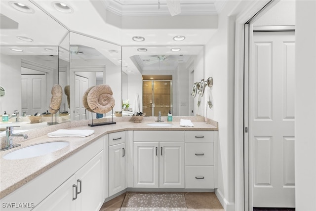 bathroom with a shower with shower door, vanity, tile patterned flooring, and ornamental molding