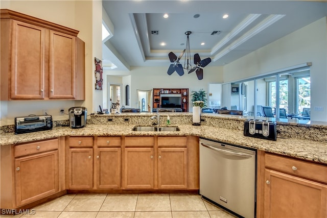 kitchen with a raised ceiling, sink, stainless steel dishwasher, light stone countertops, and light tile patterned floors