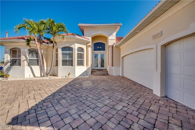 view of front of home featuring french doors and a garage