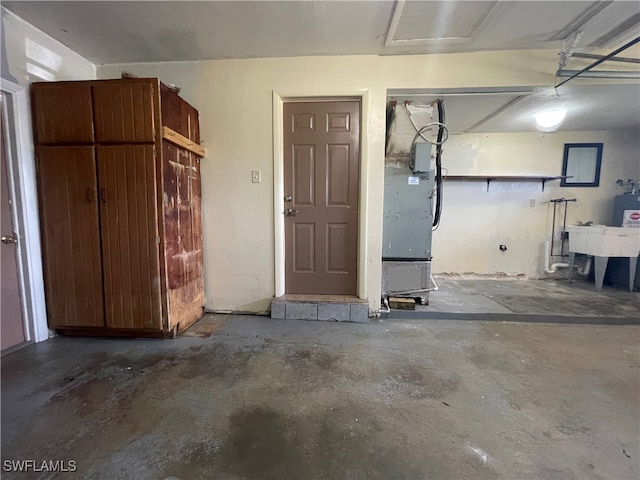 garage with sink and heating unit