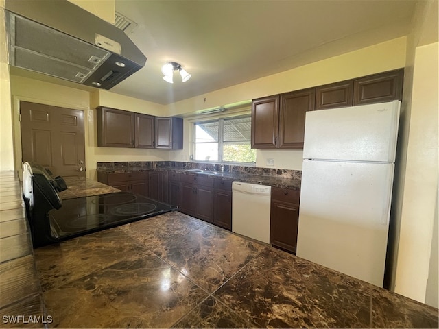 kitchen with sink, exhaust hood, dark brown cabinets, and white appliances