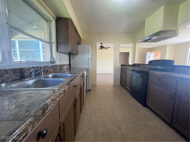 kitchen with sink, electric range, ceiling fan, dark brown cabinetry, and light tile patterned floors