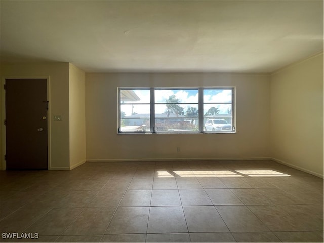 empty room with light tile patterned flooring