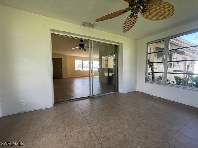 unfurnished bedroom featuring a closet, ceiling fan, and tile patterned flooring