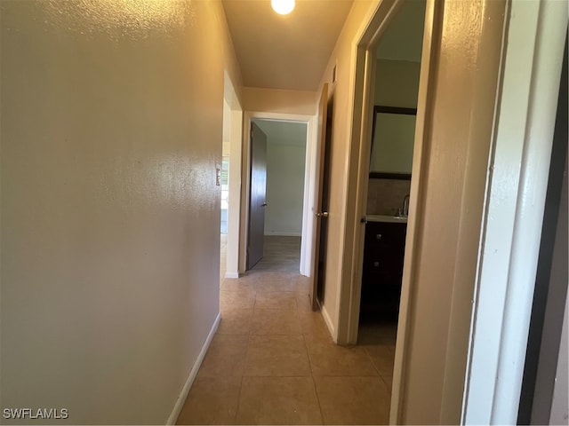 hallway with light tile patterned flooring