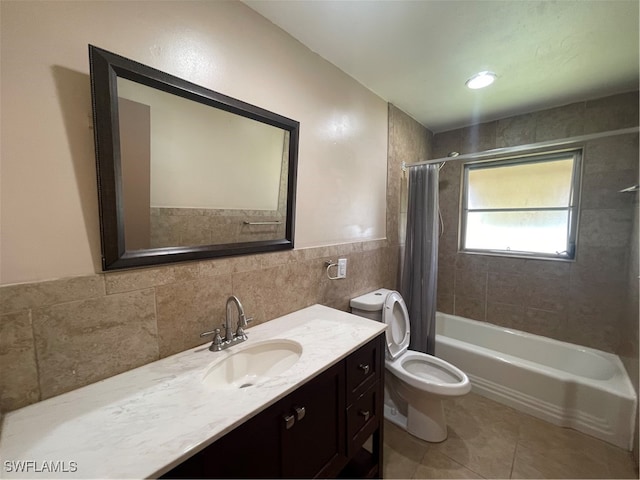 full bathroom with shower / bathtub combination with curtain, tile walls, toilet, vanity, and tile patterned flooring