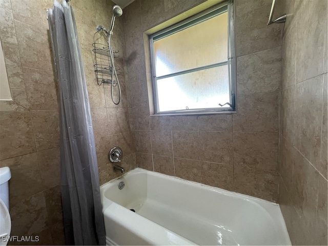 bathroom with shower / tub combo with curtain