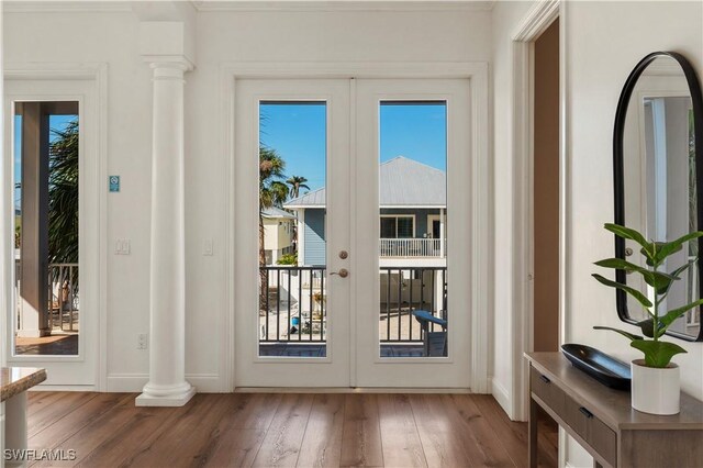 270 Delmar Ave, Fort Myers Beach, FL 33931 - doorway with hardwood / wood-style floors, ornate columns, baseboards, and french doors