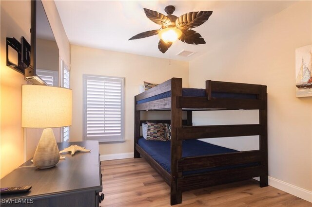 270 Delmar Ave, Fort Myers Beach, FL 33931 - bedroom featuring baseboards, wood finished floors, and ceiling fan
