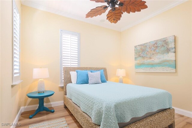 270 Delmar Ave, Fort Myers Beach, FL 33931 - bedroom featuring crown molding, baseboards, and wood finished floors