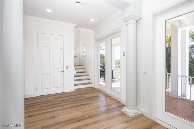 270 Delmar Ave, Fort Myers Beach, FL 33931 - foyer with french doors, crown molding, decorative columns, light wood finished floors, and recessed lighting