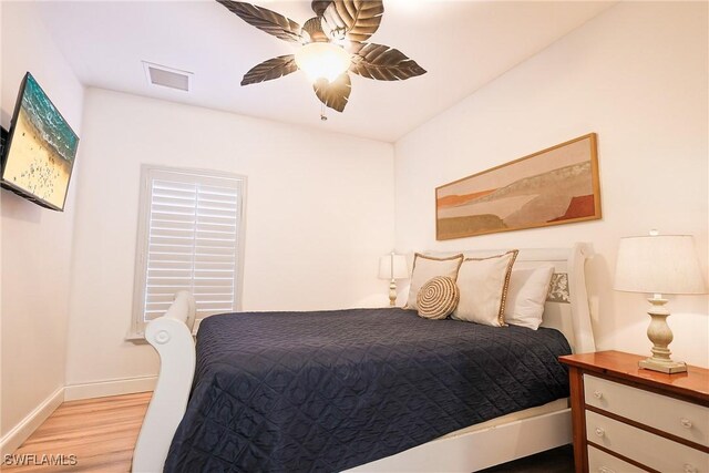 270 Delmar Ave, Fort Myers Beach, FL 33931 - bedroom with light wood-style floors, baseboards, and a ceiling fan