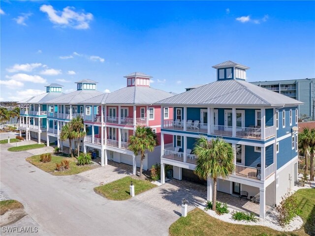 270 Delmar Ave, Fort Myers Beach, FL 33931 - view of building exterior featuring driveway and a garage