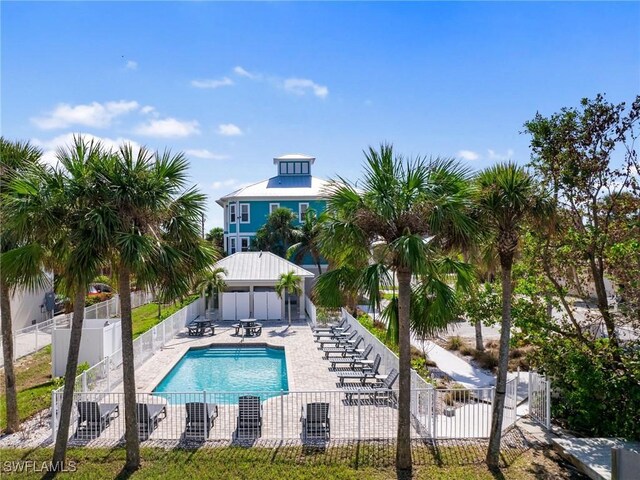 270 Delmar Ave, Fort Myers Beach, FL 33931 - community pool featuring a fenced backyard and a patio area