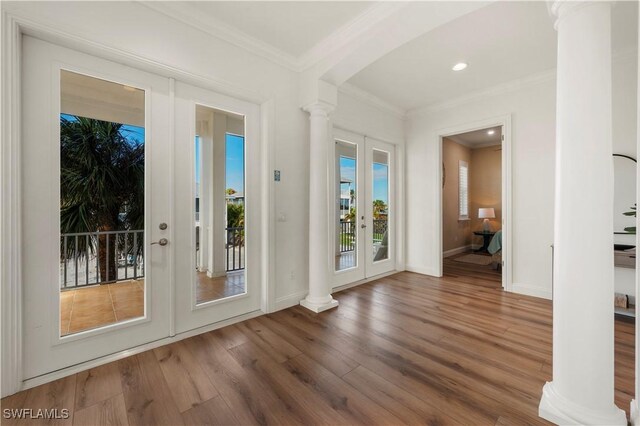 270 Delmar Ave, Fort Myers Beach, FL 33931 - entryway featuring ornate columns, french doors, wood finished floors, crown molding, and baseboards