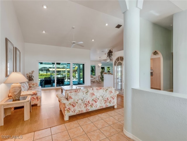 living room featuring light hardwood / wood-style flooring and ceiling fan