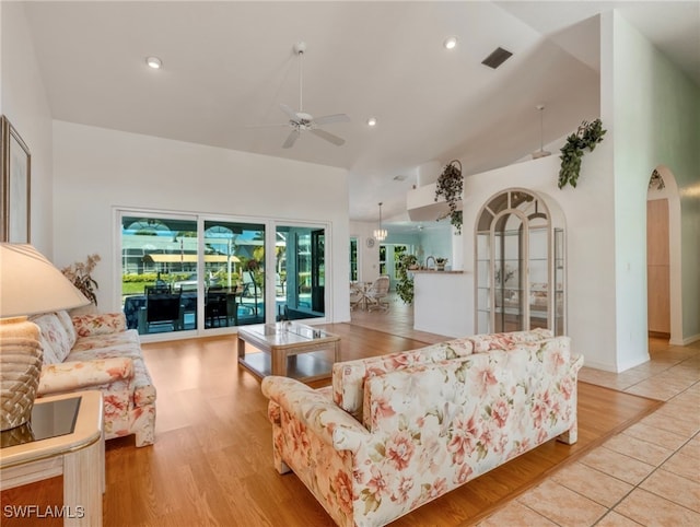 living room with light hardwood / wood-style floors and ceiling fan