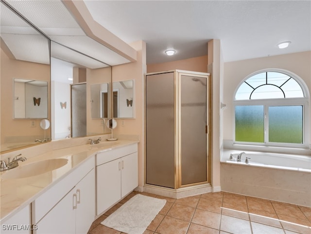 bathroom with vanity, plus walk in shower, and tile patterned flooring