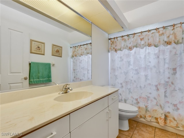 bathroom with vanity, toilet, and tile patterned floors