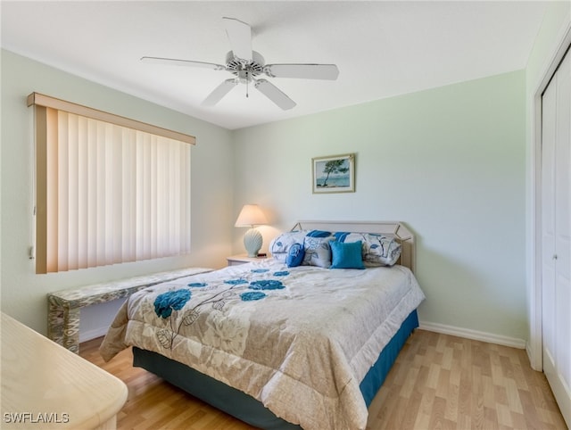 bedroom featuring a closet, ceiling fan, and light hardwood / wood-style flooring