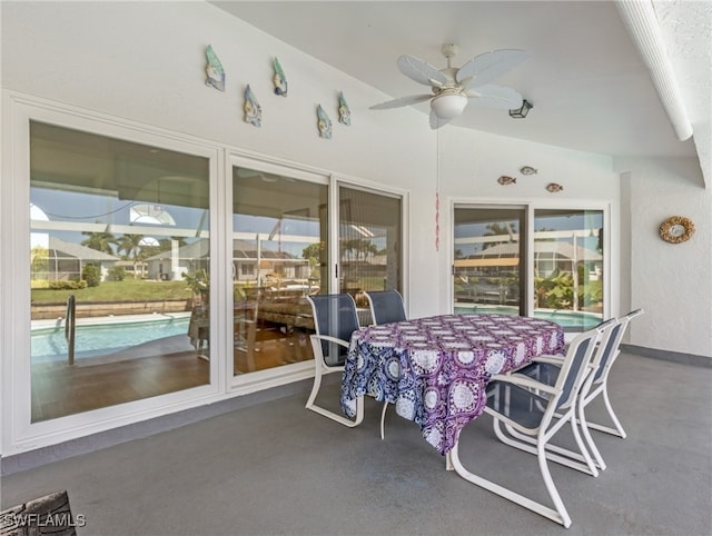 sunroom featuring ceiling fan and a wealth of natural light