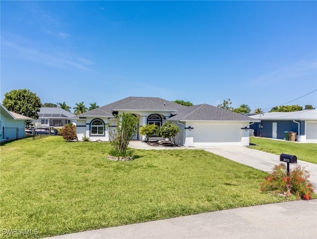 ranch-style home featuring a garage and a front lawn