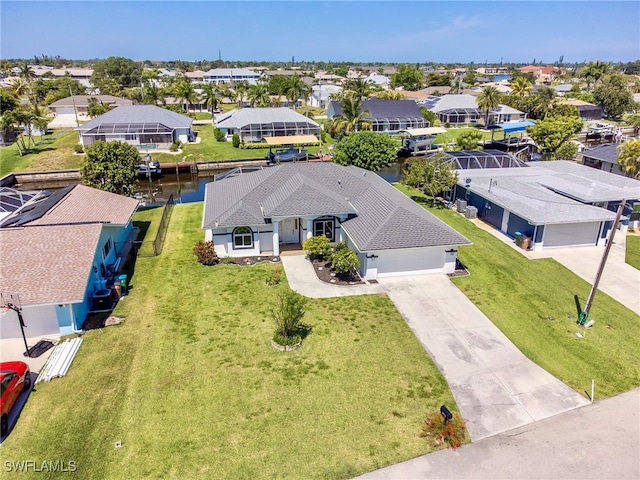 birds eye view of property with a water view