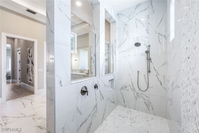 bathroom featuring a tile shower