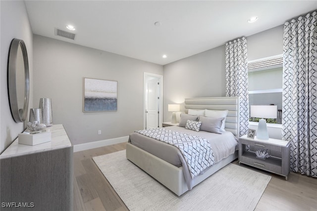 bedroom with light hardwood / wood-style flooring