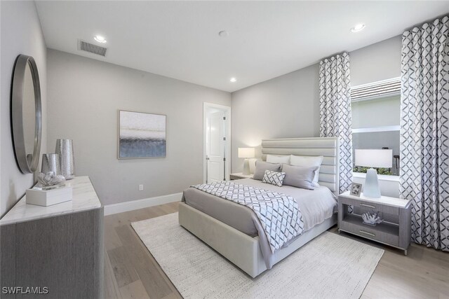 8903 Nevis Way, Naples, FL 34112 - bedroom featuring visible vents, recessed lighting, light wood finished floors, and baseboards