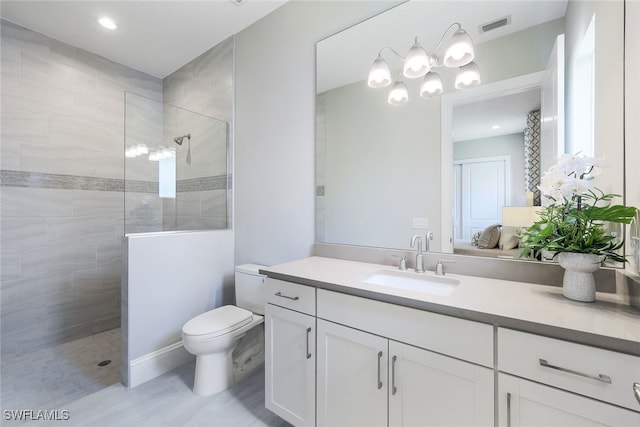 8903 Nevis Way, Naples, FL 34112 - bathroom with visible vents, a walk in shower, vanity, toilet, and a chandelier