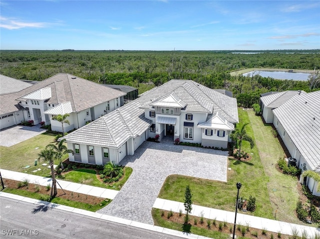 8903 Nevis Way, Naples, FL 34112 - birds eye view of property with a water view and a wooded view